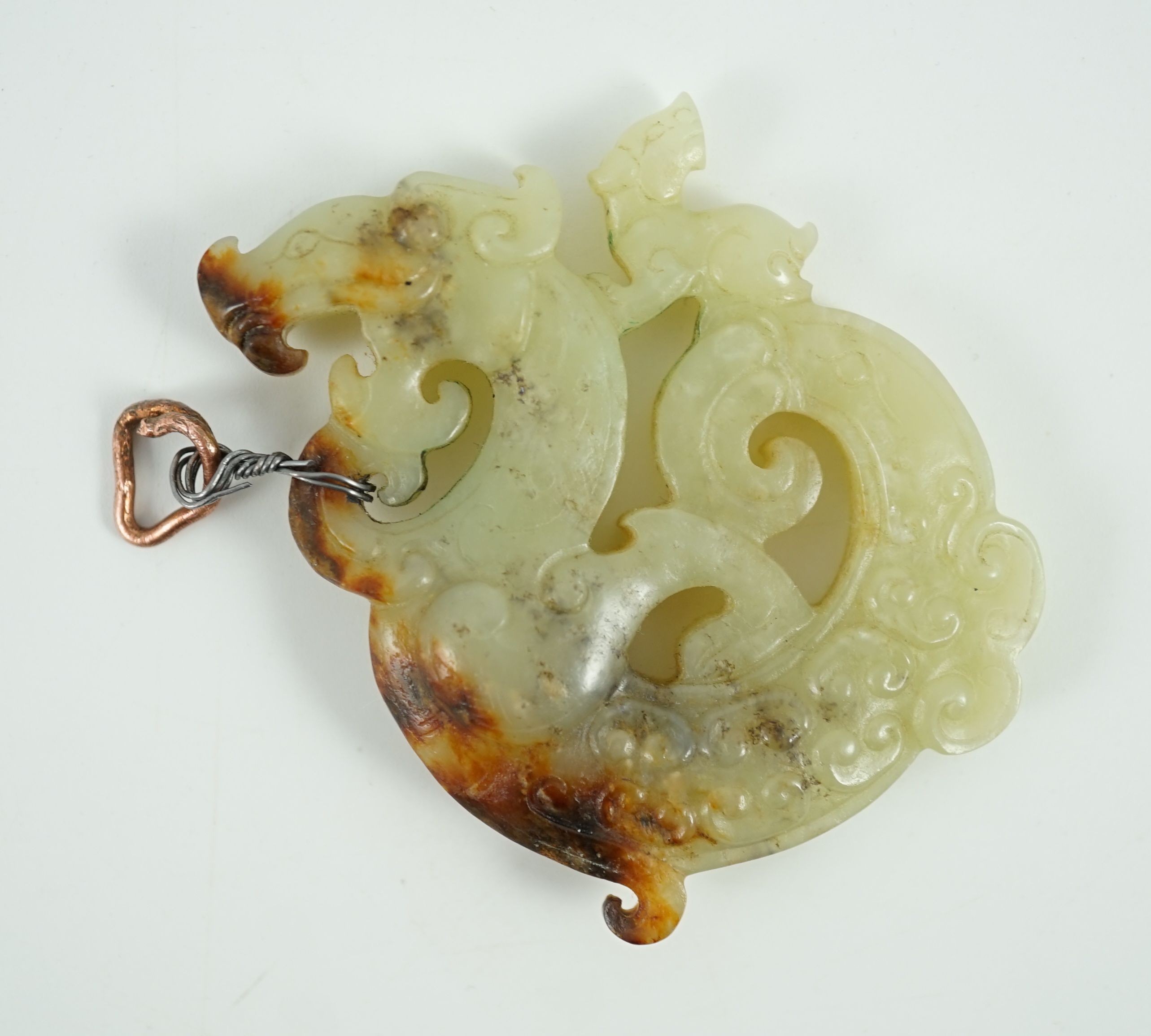 A Chinese archaistic yellow and russet jade openwork plaque, possibly Song-Yuan dynasty, 6.8cm